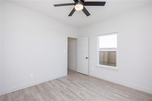 spare room featuring ceiling fan and light wood-type flooring