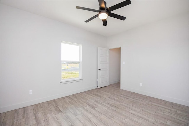 spare room with ceiling fan and light hardwood / wood-style floors