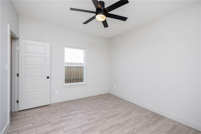 unfurnished room with ceiling fan