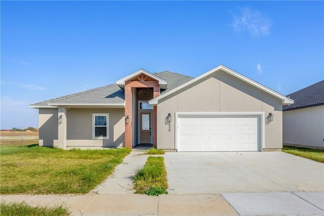 ranch-style home with a garage and a front lawn