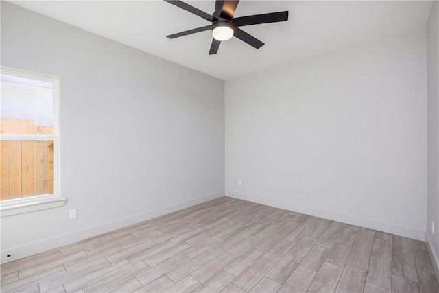 spare room featuring light hardwood / wood-style floors and ceiling fan