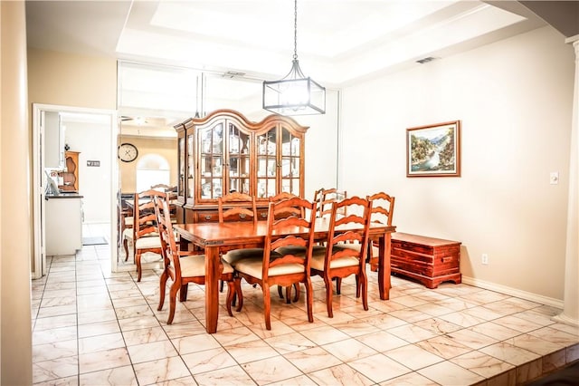 7526 Milan St, Corpus Christi, TX 78414 - dining area featuring a raised ceiling, marble finish floor, and decorative columns