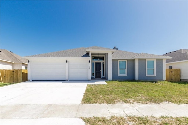 single story home with a garage and a front yard