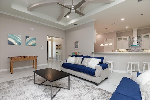 living room with crown molding and ceiling fan