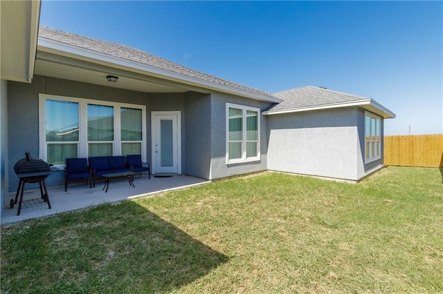 back of house featuring a yard, an outdoor hangout area, and a patio area