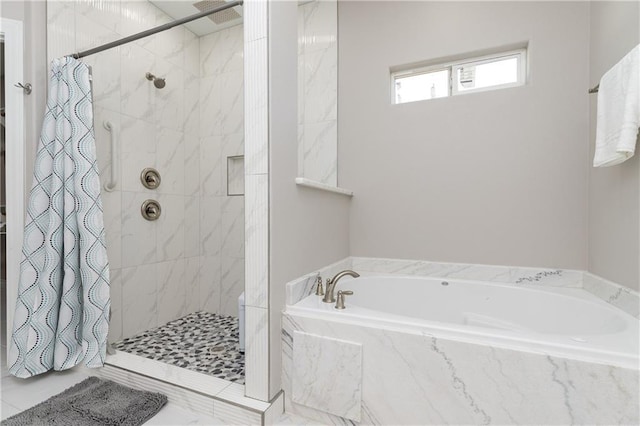 bathroom with separate shower and tub