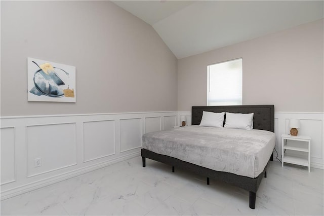 bedroom featuring lofted ceiling