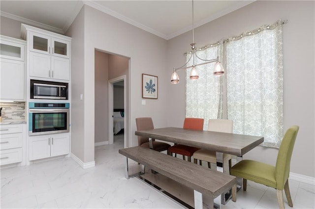 dining area featuring ornamental molding