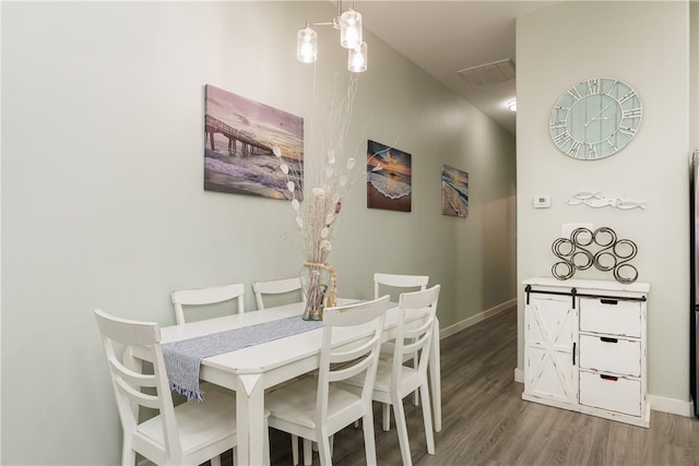 dining area featuring wood-type flooring