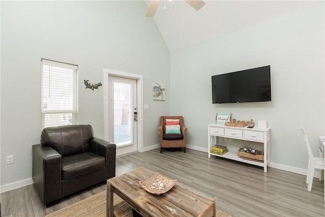 14921 Pirates Cove Dr, Corpus Christi, TX 78418 - living area with high vaulted ceiling, light wood-style flooring, baseboards, and ceiling fan