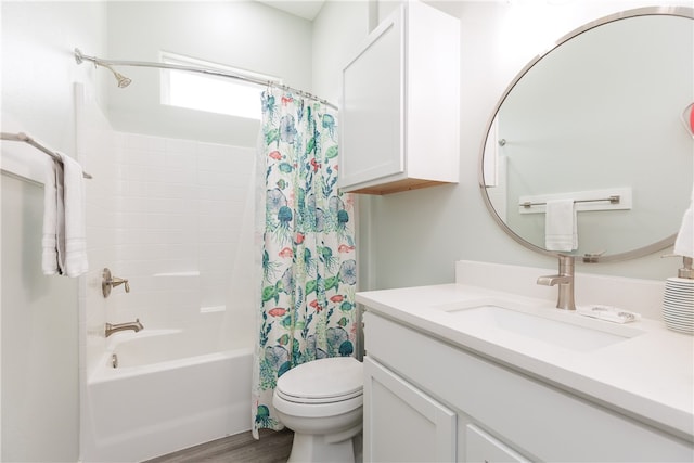 full bathroom featuring toilet, wood-type flooring, vanity, and shower / tub combo with curtain