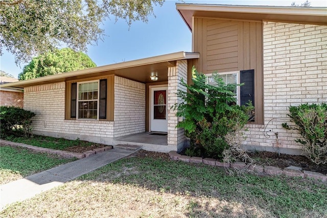 2738 Wind Rock Dr, Corpus Christi, TX 78410 - view of exterior entry featuring brick siding