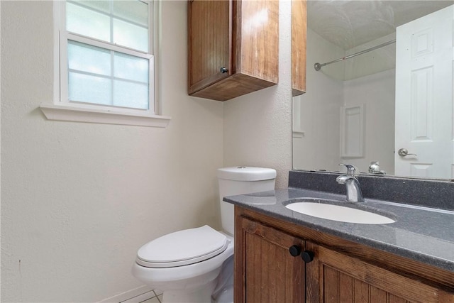 2738 Wind Rock Dr, Corpus Christi, TX 78410 - bathroom featuring toilet, vanity, and a textured wall