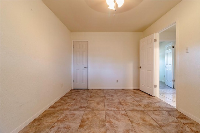 2738 Wind Rock Dr, Corpus Christi, TX 78410 - unfurnished room featuring ceiling fan, light tile patterned flooring, and baseboards