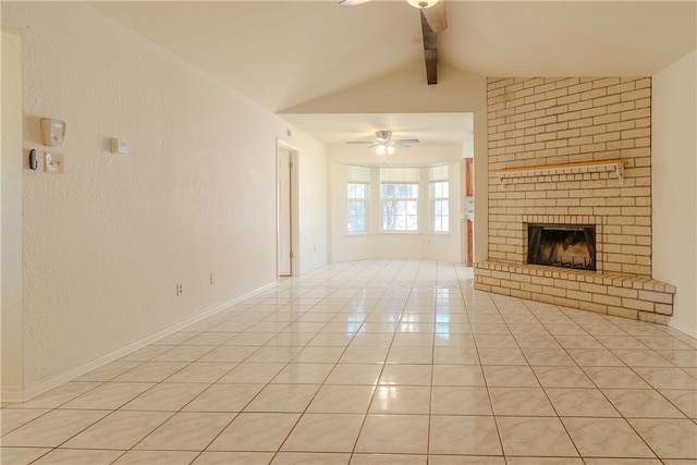 unfurnished living room with a brick fireplace, ceiling fan, light tile patterned floors, and lofted ceiling with beams