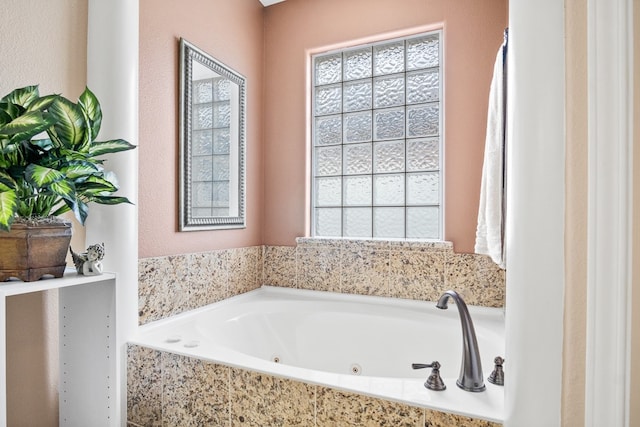 bathroom featuring tiled tub