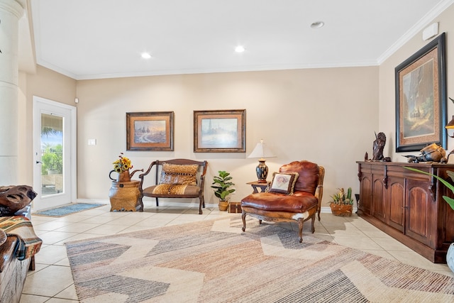 sitting room with light tile patterned floors and crown molding