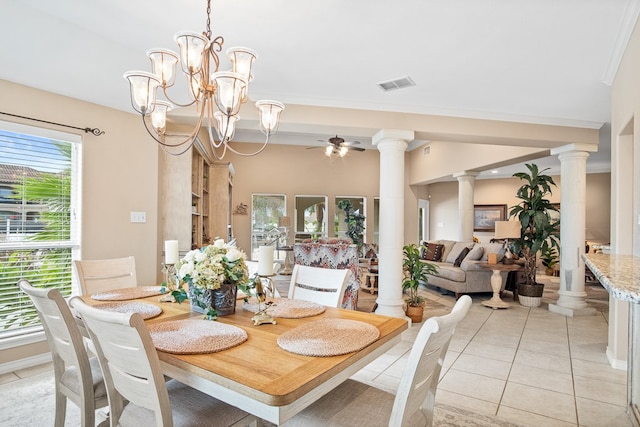 tiled dining area featuring ceiling fan with notable chandelier and crown molding