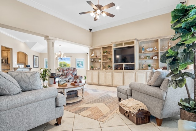 living room with light tile patterned flooring, ornamental molding, ceiling fan with notable chandelier, built in features, and ornate columns