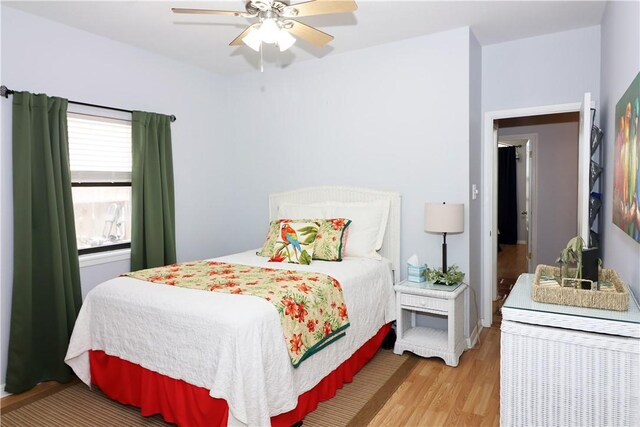 15641 Three Fathoms Bank Dr, Corpus Christi, TX 78418 - bedroom featuring light wood-style floors and a ceiling fan