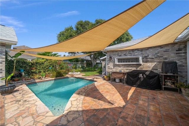 15641 Three Fathoms Bank Dr, Corpus Christi, TX 78418 - view of swimming pool with a patio area, a fenced backyard, and area for grilling
