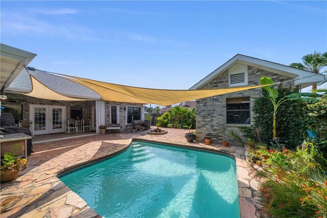 15641 Three Fathoms Bank Dr, Corpus Christi, TX 78418 - swimming pool featuring french doors and a patio