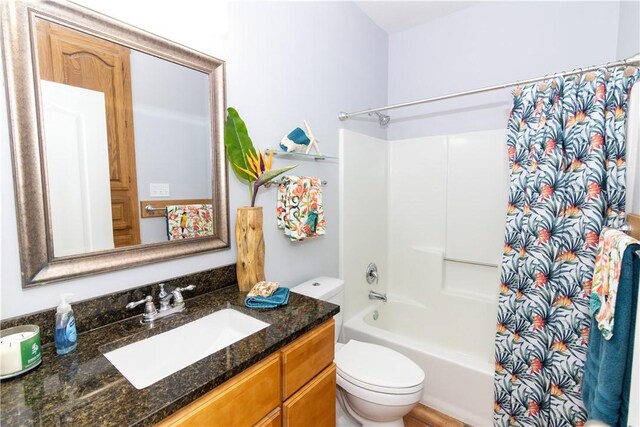 15641 Three Fathoms Bank Dr, Corpus Christi, TX 78418 - full bath featuring vanity, shower / tub combo with curtain, and toilet