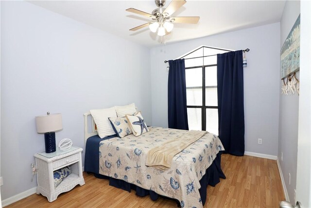 15641 Three Fathoms Bank Dr, Corpus Christi, TX 78418 - bedroom with wood finished floors, baseboards, and a ceiling fan