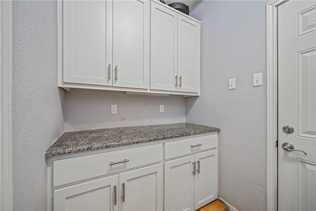 15641 Three Fathoms Bank Dr, Corpus Christi, TX 78418 - kitchen with white cabinets and dark stone countertops