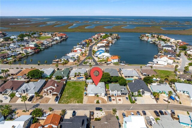 15641 Three Fathoms Bank Dr, Corpus Christi, TX 78418 - aerial view of property and surrounding area featuring nearby suburban area and a nearby body of water