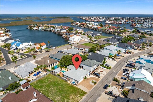 15641 Three Fathoms Bank Dr, Corpus Christi, TX 78418 - aerial view of property and surrounding area featuring a large body of water and nearby suburban area