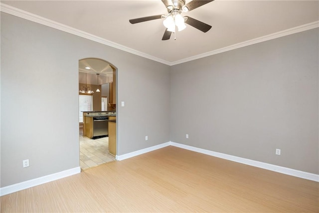 spare room with ceiling fan with notable chandelier, crown molding, and light hardwood / wood-style flooring