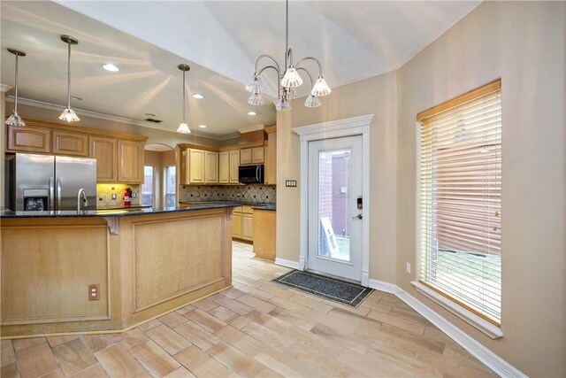 kitchen featuring backsplash, an inviting chandelier, stainless steel refrigerator with ice dispenser, hanging light fixtures, and ornamental molding