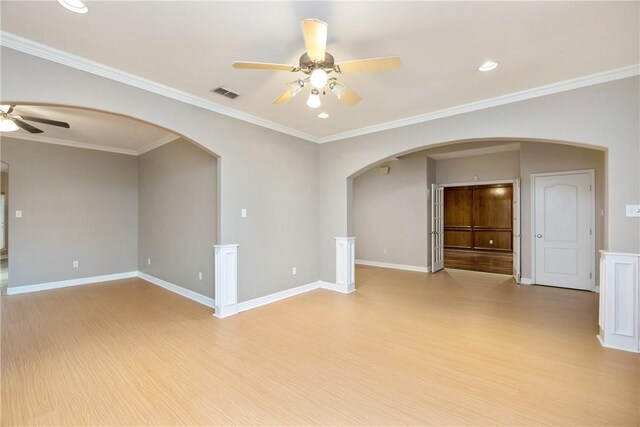 unfurnished room with light hardwood / wood-style flooring, ceiling fan, and ornamental molding