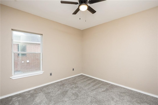 empty room with carpet flooring and ceiling fan