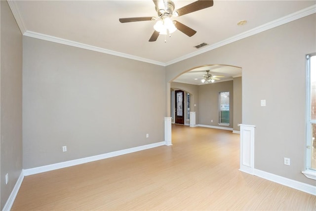 spare room featuring ceiling fan, light hardwood / wood-style floors, and ornamental molding