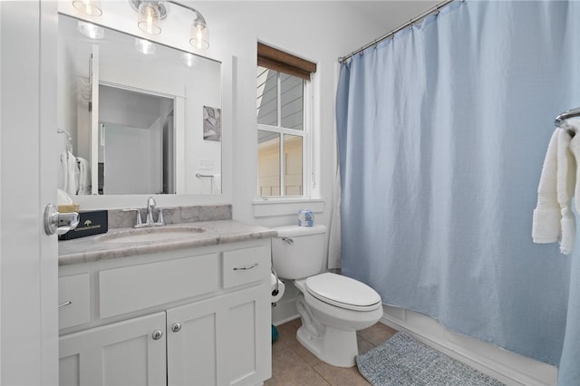 full bathroom with vanity, shower / bath combo, tile patterned floors, and toilet