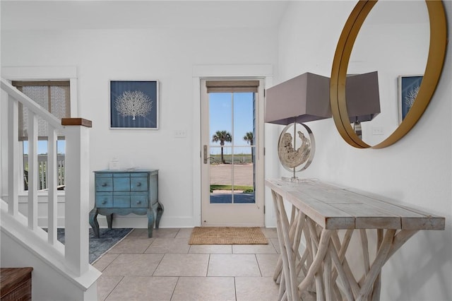 tiled foyer entrance with a wealth of natural light