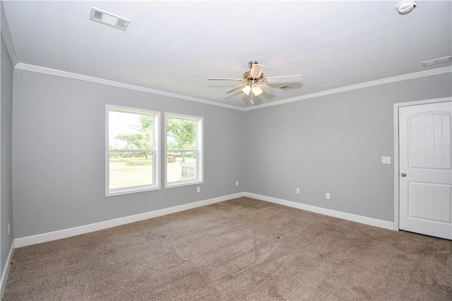 carpeted empty room featuring ornamental molding, visible vents, and a ceiling fan