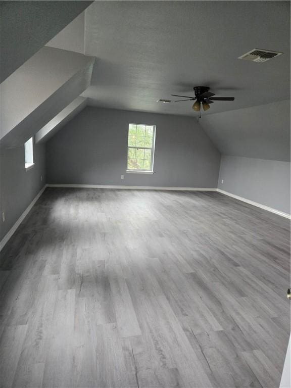 7921 Etienne Dr, Corpus Christi, TX 78414 - bonus room with ceiling fan, lofted ceiling, and wood finished floors