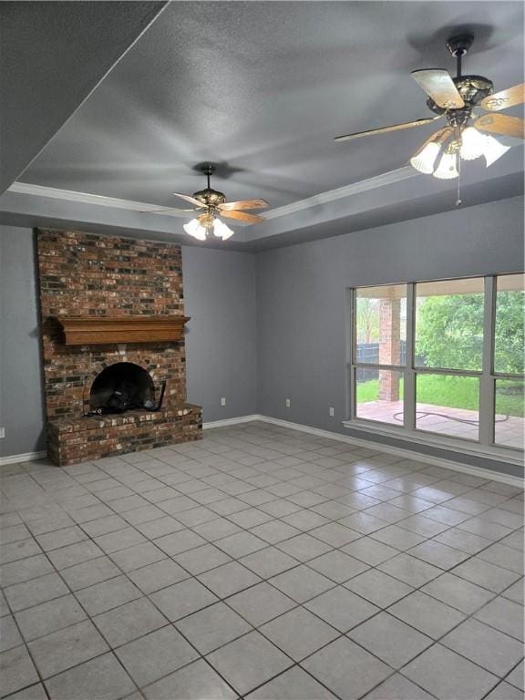 7921 Etienne Dr, Corpus Christi, TX 78414 - unfurnished living room featuring a raised ceiling, a ceiling fan, a brick fireplace, light tile patterned floors, and crown molding