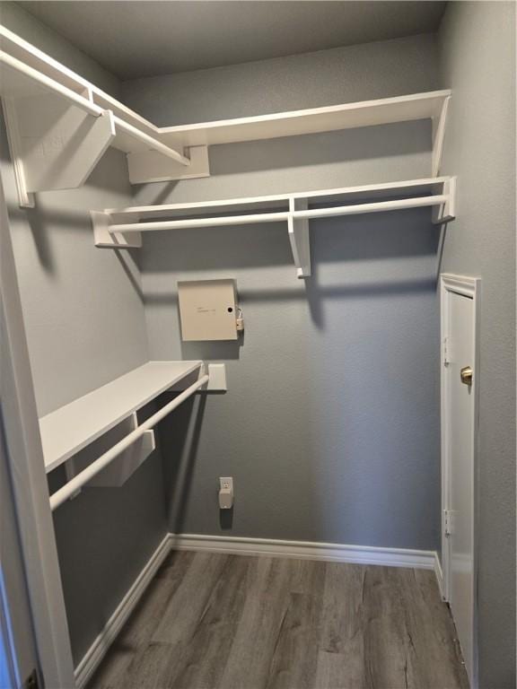 7921 Etienne Dr, Corpus Christi, TX 78414 - walk in closet with wood finished floors