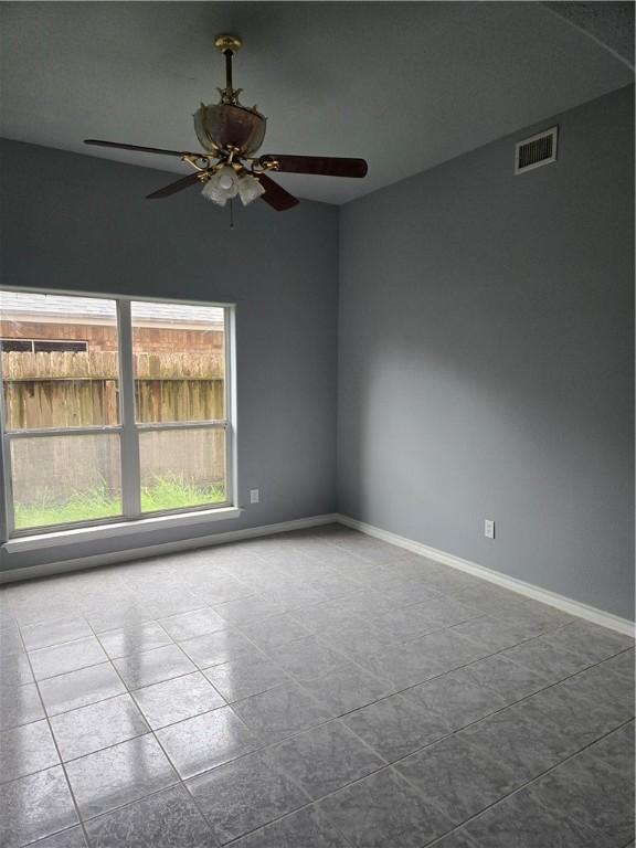 7921 Etienne Dr, Corpus Christi, TX 78414 - tiled spare room featuring ceiling fan and baseboards