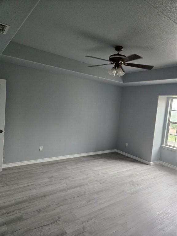 7921 Etienne Dr, Corpus Christi, TX 78414 - unfurnished room with wood finished floors, ceiling fan, and a textured ceiling