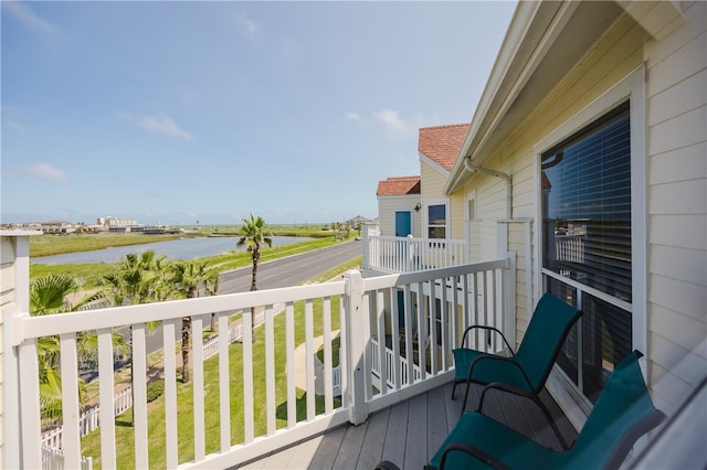 balcony featuring a water view