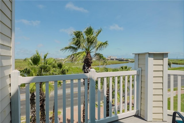 balcony featuring a water view