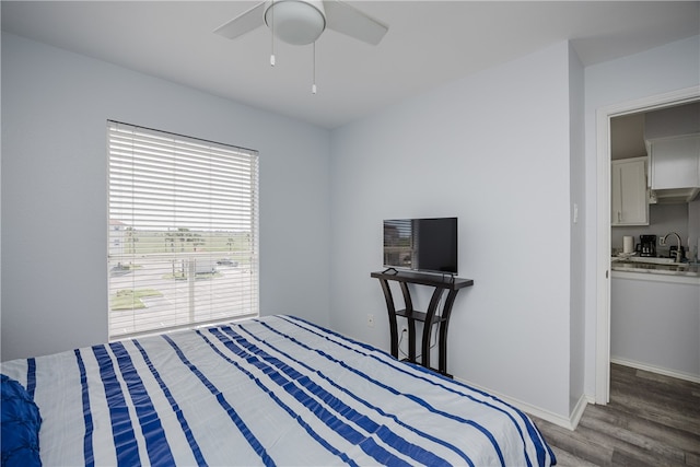 bedroom featuring hardwood / wood-style flooring and ceiling fan