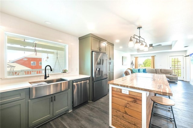 502 Corpus Christi Channel Prt, Aransas, TX 78373 - kitchen with appliances with stainless steel finishes, dark wood-type flooring, a breakfast bar area, open floor plan, and recessed lighting