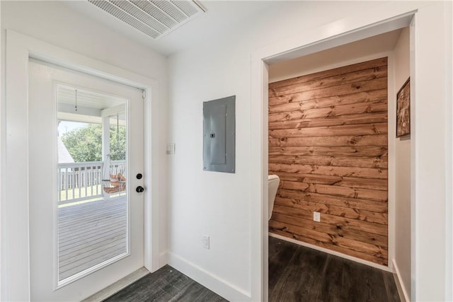 502 Corpus Christi Channel Prt, Aransas, TX 78373 - doorway to outside with electric panel and dark wood finished floors