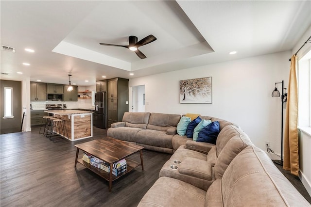 502 Corpus Christi Channel Prt, Aransas, TX 78373 - living room with a raised ceiling, a ceiling fan, dark wood-type flooring, and recessed lighting
